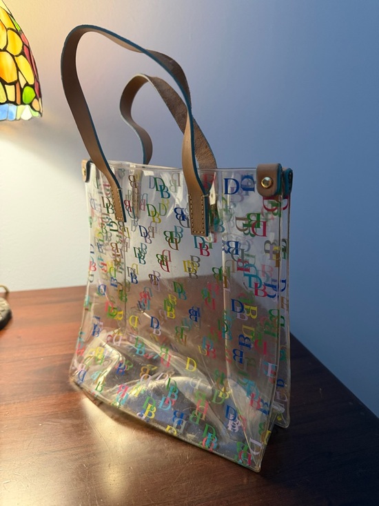Dooney & Bourke Handbags - Dooney & Bourke Clear Tote with Multicolor DB Logos and Brown Handles